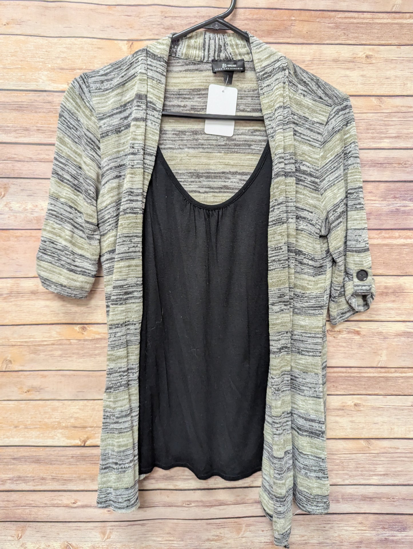 Cardigan/tank top size L. RS 22.