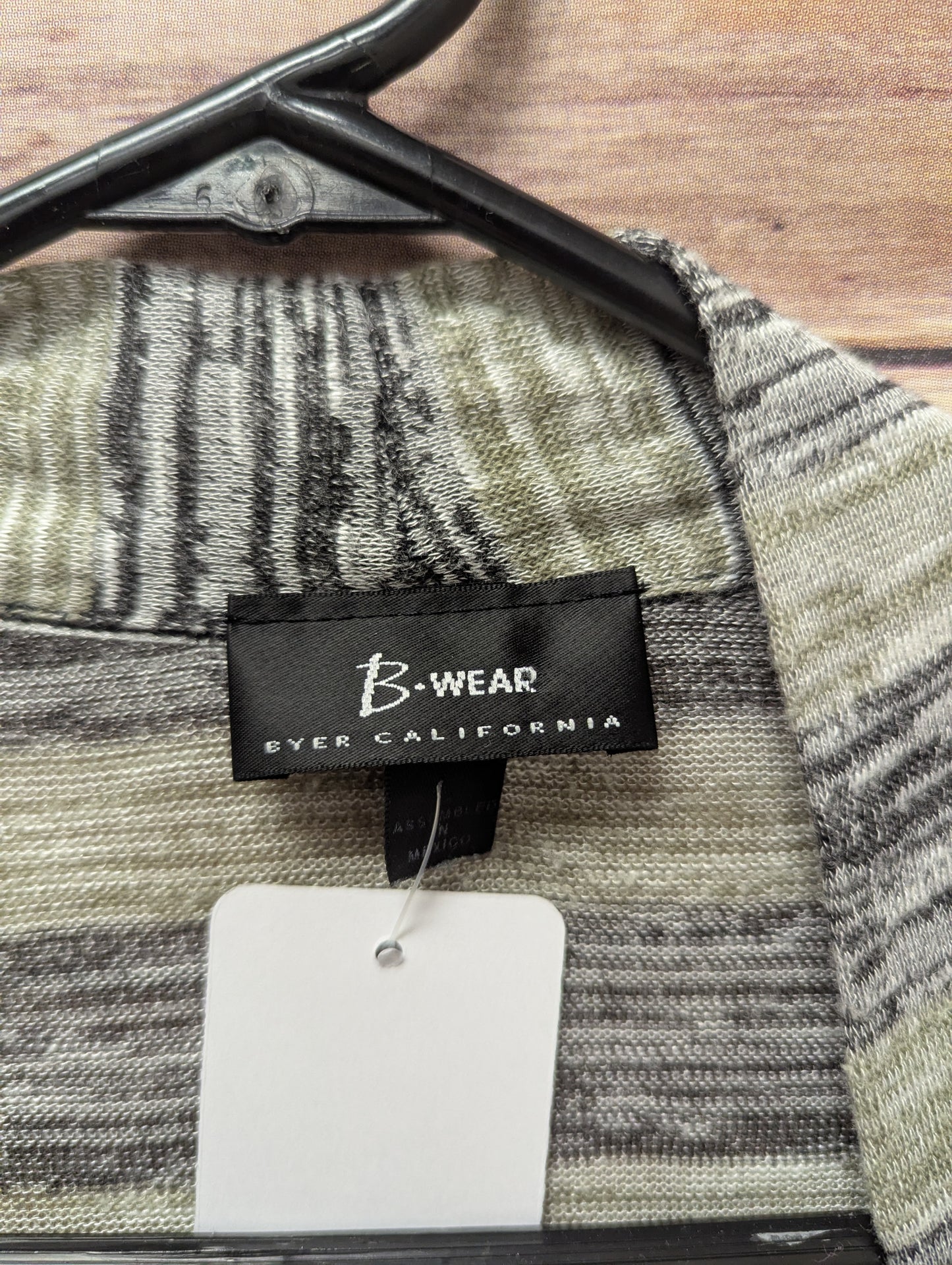 Cardigan/tank top size L. RS 22.
