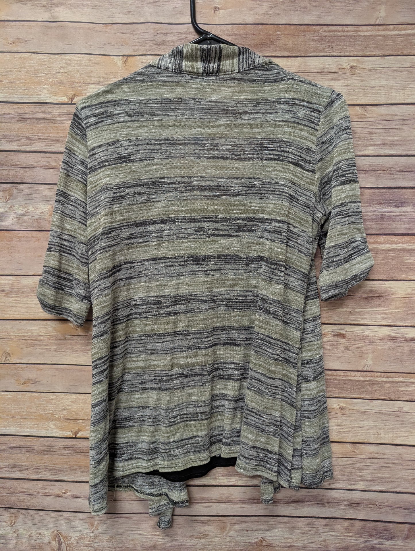 Cardigan/tank top size L. RS 22.