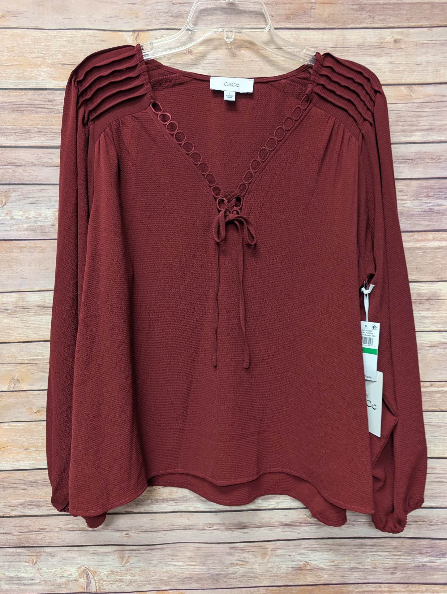 Cece wine long sleeve top. Size M. RS 97