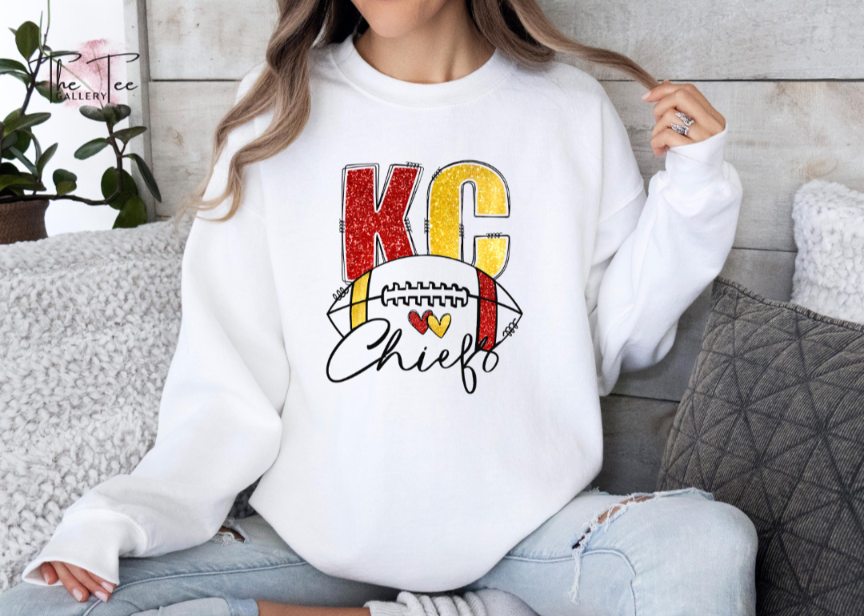 White KC faux glitter sweatshirt.