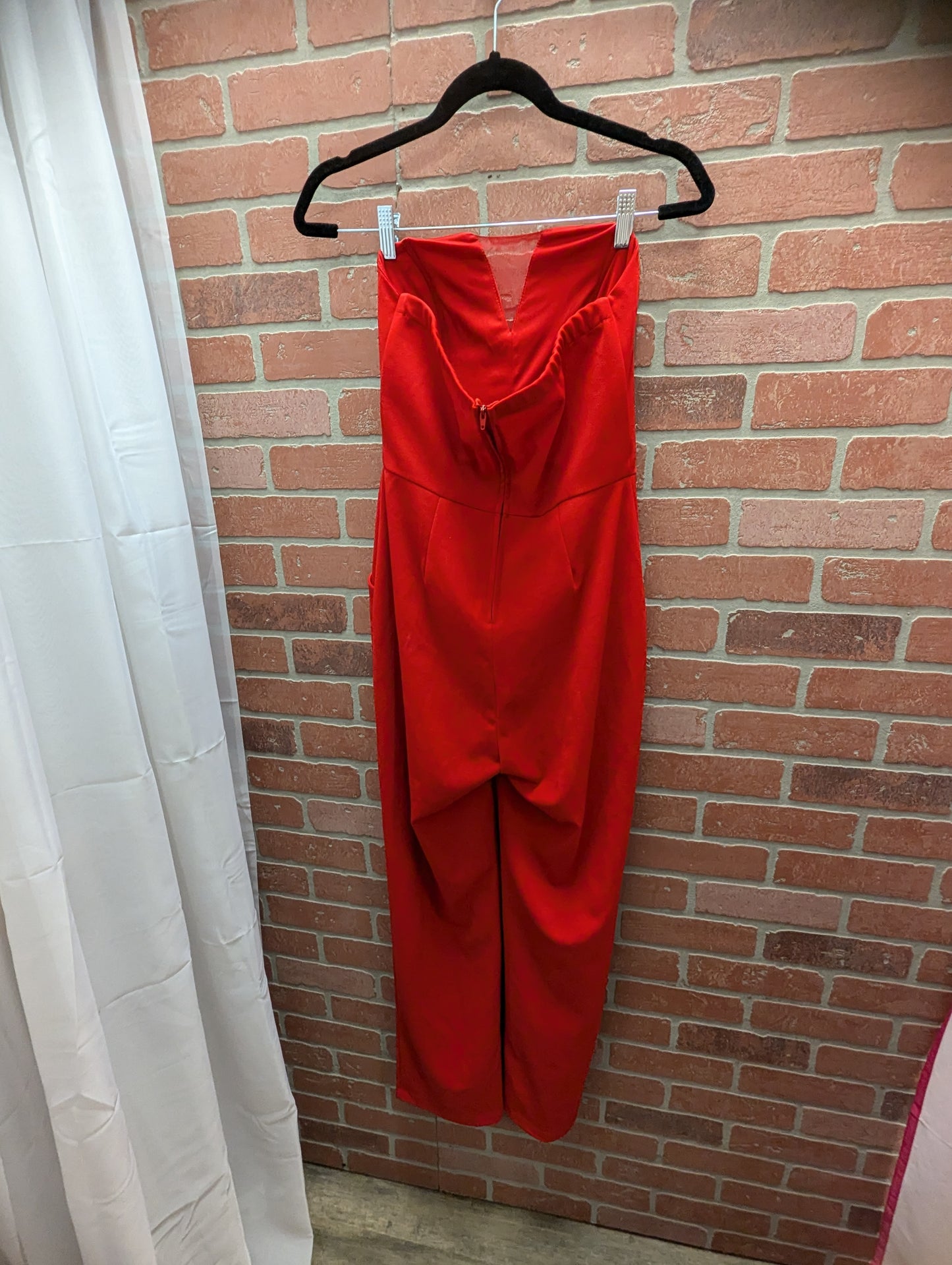 Red strapless jumpsuit with pockets. Size 7. RS-5