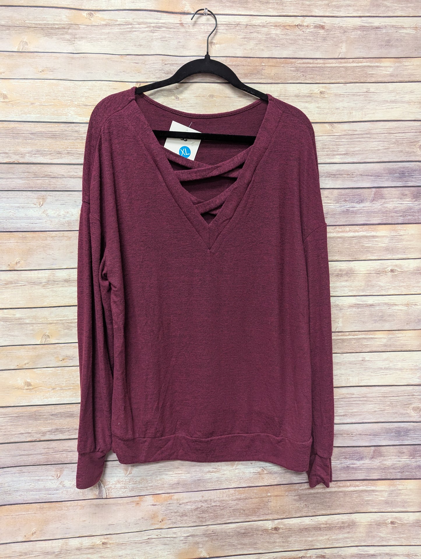 Cross front wine colored long sleeve sweater